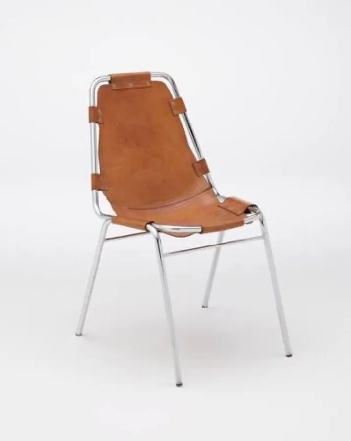 A tan leather sling chair on a chrome frame