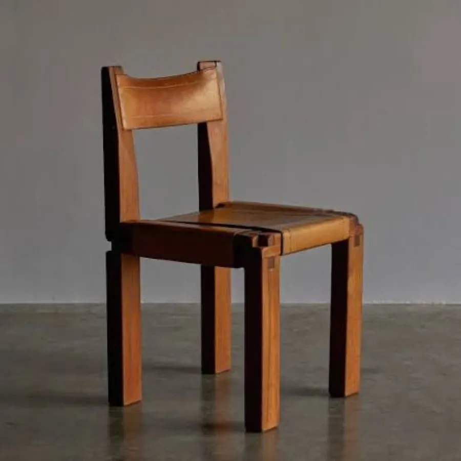 A dark elm chair with a leather seat